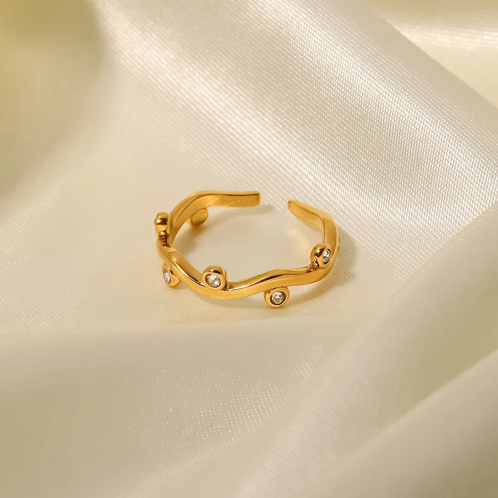 Shiny gold Joree ring with playful design and sparkling accents, perfect for brightening your everyday style.